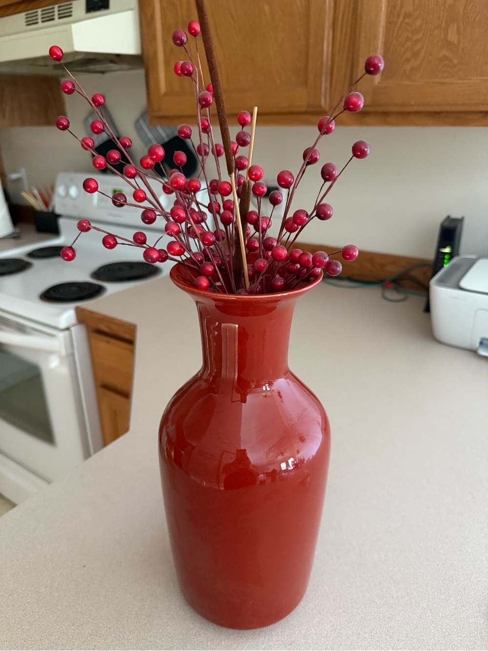 Glossy Red Ceramic Decorative Vase with Matching Berry Stems